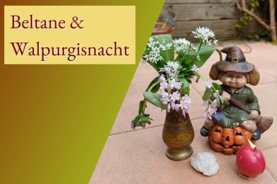 Blumen und Kerze für das Jahreskreisfest Beltane, Walpurgisnacht, Maifest
